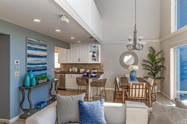 Chandelier, Dining room, Interior, Kitchen, Living room, Pendant Lights, Recessed Lighting, Stainless Steel Appliances, Wood Texture Flooring
