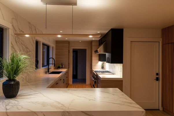 Interior, Kitchen, Marble, Marble Walls, Recessed Lighting, Stainless Steel Appliances, Wood Texture Flooring