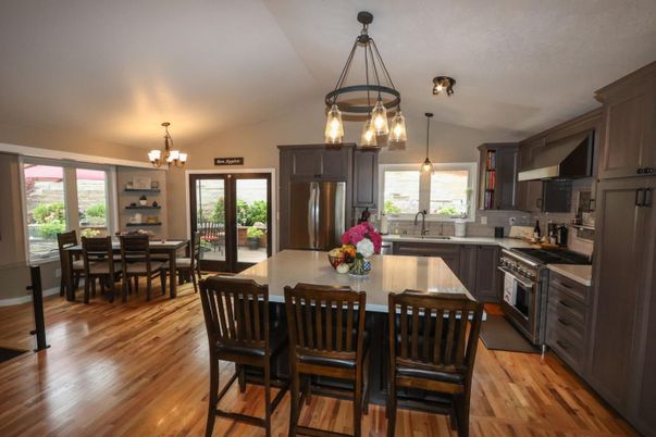 Chandelier, Dining room, Interior, Kitchen, Pendant Lights, Stainless Steel Appliances, Wood Texture Flooring