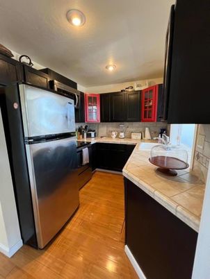 Interior, Kitchen, Recessed Lighting, Tile Countertops, Wood Texture Flooring