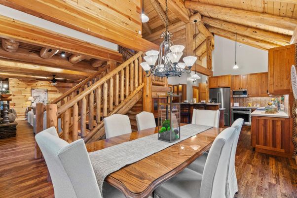 Chandelier, Dining room, Interior, Kitchen, Living room, Pendant Lights, Stainless Steel Appliances, Wooden Beams, Wooden Ceilings, Wood Texture Flooring