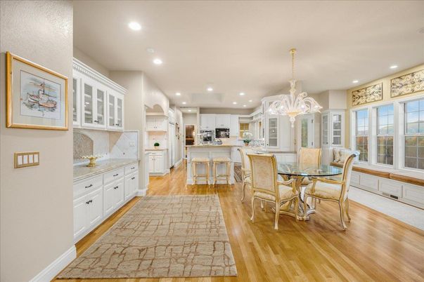 Chandelier, Dining room, Interior, Kitchen, Recessed Lighting, Stainless Steel Appliances, Wood Texture Flooring