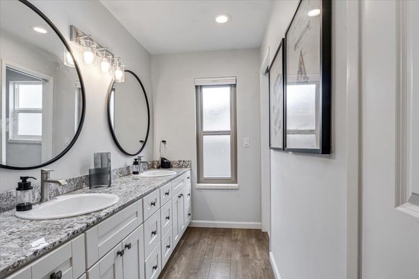 Bathroom, Dual Sink Vanities, Interior, Recessed Lighting, Wood Texture Flooring