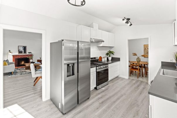 Dining room, Fireplace, Interior, Kitchen, Stainless Steel Appliances, Wood Texture Flooring
