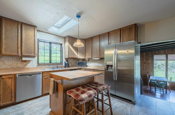 Dining room, Interior, Kitchen, Pendant Lights, Stainless Steel Appliances, Wood Texture Flooring