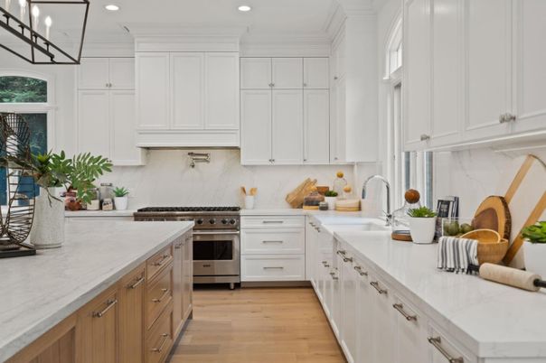 Interior, Kitchen, Marble Walls, Recessed Lighting, Stainless Steel Appliances, Wood Texture Flooring