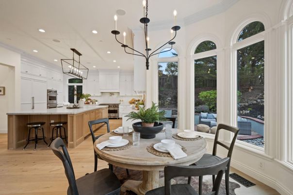 Chandelier, Dining room, Interior, Kitchen, Pendant Lights, Recessed Lighting, Stainless Steel Appliances, Wood Texture Flooring