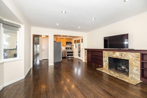 Fireplace, Interior, Kitchen, Recessed Lighting, Stainless Steel Appliances, Wood Texture Flooring