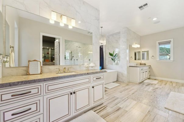 Bathroom, Dual Sink Vanities, Interior, Marble Walls, Recessed Lighting, Wood Texture Flooring