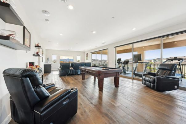 Billiard Table, Fireplace, Fitness Equipment, Game Room, Interior, Living room, Recessed Lighting, Wood Texture Flooring