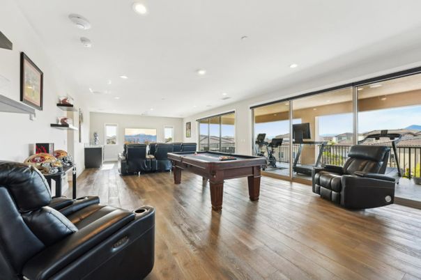 Billiard Table, Fireplace, Fitness Equipment, Game Room, Interior, Living room, Recessed Lighting, Wood Texture Flooring