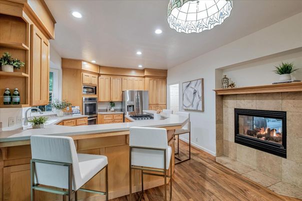 Fireplace, Interior, Kitchen, Recessed Lighting, Stainless Steel Appliances, Wood Texture Flooring