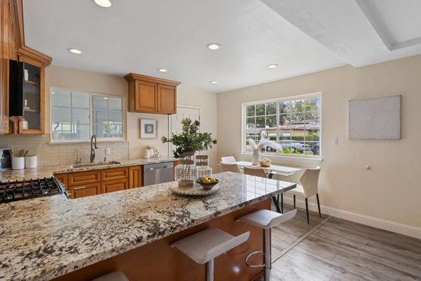 Dining room, Interior, Kitchen, Recessed Lighting, Stainless Steel Appliances, Wood Texture Flooring