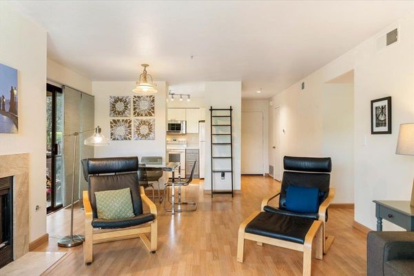 Dining room, Fireplace, Interior, Kitchen, Pendant Lights, Stainless Steel Appliances, Wood Texture Flooring