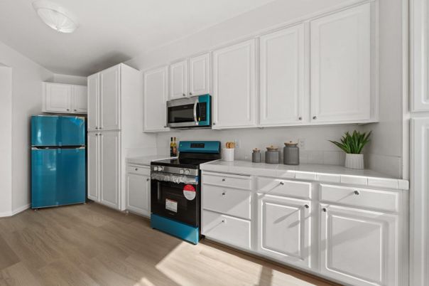 Interior, Kitchen, Tile Countertops, Wood Texture Flooring