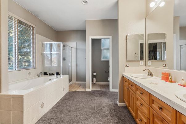 Bathroom, Dual Sink Vanities, Glass Shower, Interior, Recessed Lighting, Tile Countertops