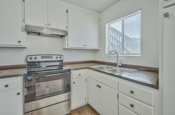 Interior, Kitchen, Stainless Steel Appliances, Tile Countertops, Wood Texture Flooring