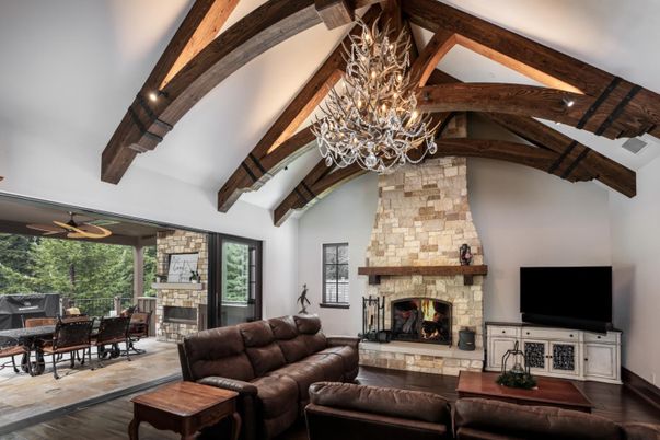 Chandelier, Dining room, Fireplace, Interior, Living room, Stone Walls, Wooden Beams, Wood Texture Flooring