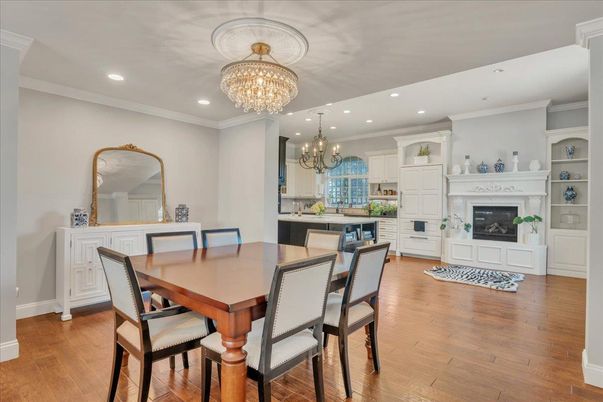 Chandelier, Dining room, Fireplace, Interior, Recessed Lighting, Wood Texture Flooring