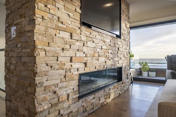 Fireplace, Interior, Recessed Lighting, Stone Walls, Water, Wood Texture Flooring