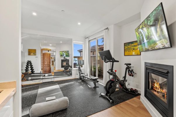 Fireplace, Fitness Equipment, Interior, Recessed Lighting, Wood Texture Flooring