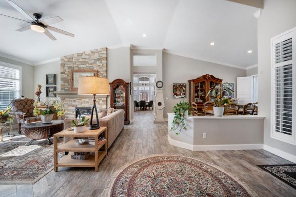 Fireplace, Interior, Living room, Recessed Lighting, Stone Walls, Wood Texture Flooring