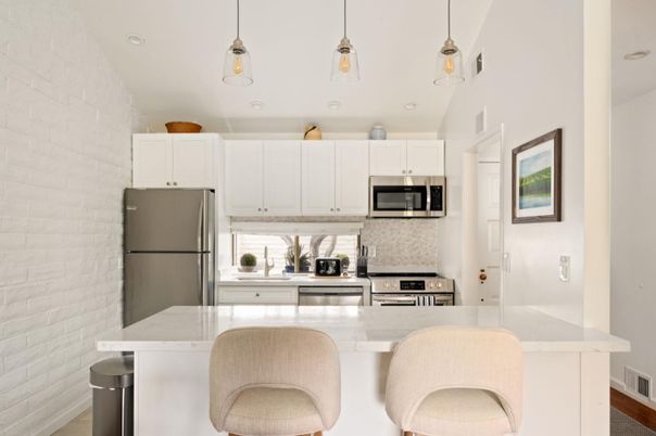 Interior, Kitchen, Pendant Lights, Recessed Lighting, Stainless Steel Appliances, Stone Walls, Wood Texture Flooring