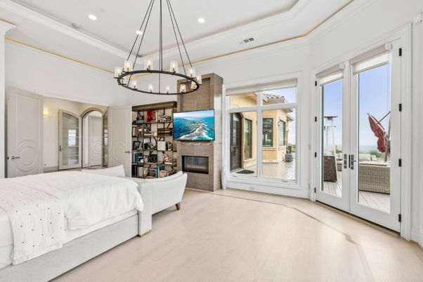 Bedroom, Chandelier, Fireplace, Interior, Recessed Lighting, Wood Texture Flooring