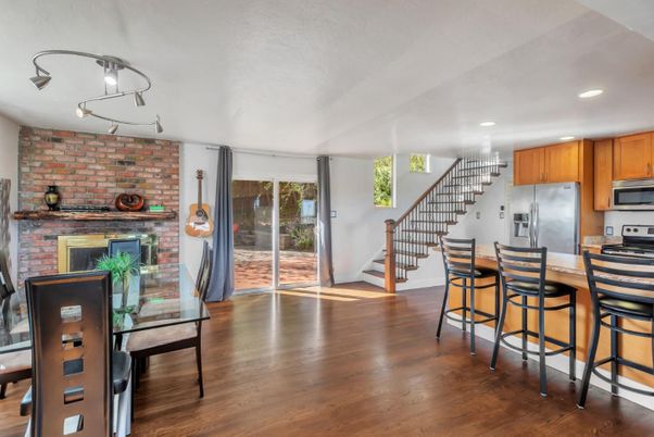 Dining room, Fireplace, Interior, Kitchen, Recessed Lighting, Stone Walls, Wood Texture Flooring