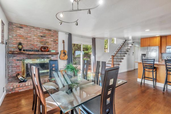 Dining room, Fireplace, Interior, Kitchen, Recessed Lighting, Stone Walls, Wood Texture Flooring