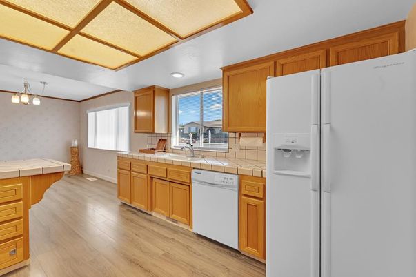Interior, Kitchen, Recessed Lighting, Tile Countertops, Wood Texture Flooring