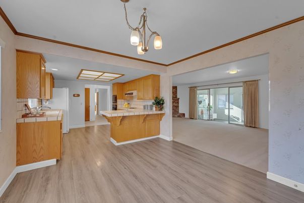 Interior, Kitchen, Pendant Lights, Tile Countertops, Wood Texture Flooring
