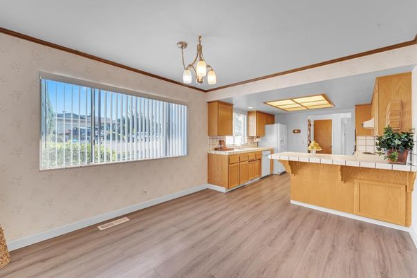 Interior, Kitchen, Pendant Lights, Tile Countertops, Wood Texture Flooring