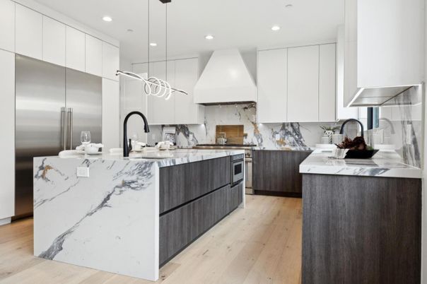 Interior, Kitchen, Marble Walls, Pendant Lights, Recessed Lighting, Stainless Steel Appliances, Wood Texture Flooring