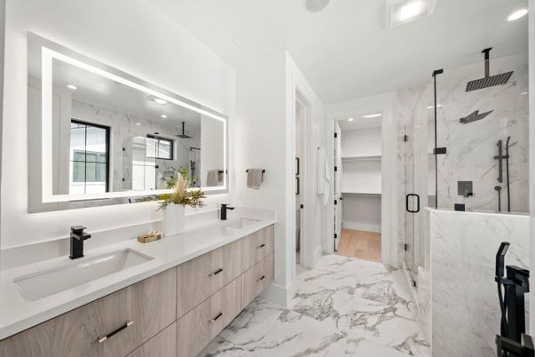 Bathroom, Dual Sink Vanities, Glass Shower, Interior, Marble, Marble Walls, Recessed Lighting, Walk-in Closets