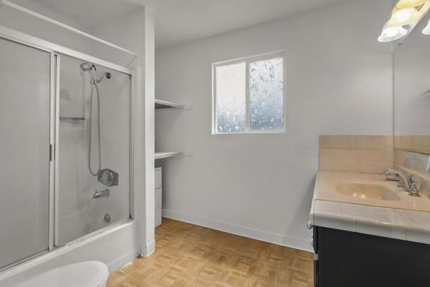 Bathroom, Glass Shower, Interior, Tile Countertops, Wood Texture Flooring