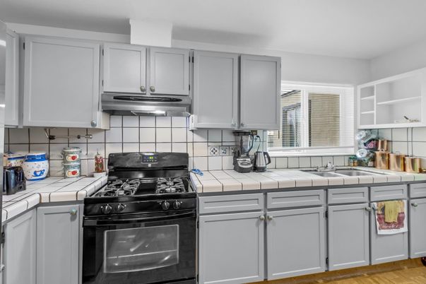 Interior, Kitchen, Tile Countertops, Wood Texture Flooring