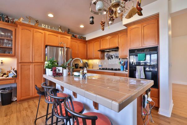 Interior, Kitchen, Recessed Lighting, Tile Countertops, Wood Texture Flooring