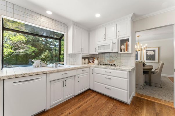 Chandelier, Dining room, Interior, Kitchen, Recessed Lighting, Tile Countertops, Wood Texture Flooring