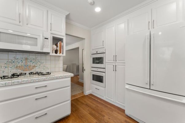 Interior, Kitchen, Recessed Lighting, Tile Countertops, Wood Texture Flooring