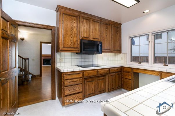 Interior, Kitchen, Recessed Lighting, Tile Countertops, Wood Texture Flooring