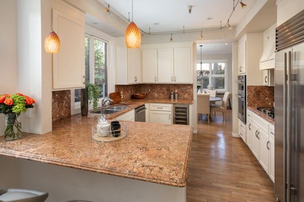 Chandelier, Dining room, Interior, Kitchen, Pendant Lights, Recessed Lighting, Stainless Steel Appliances, Wood Texture Flooring