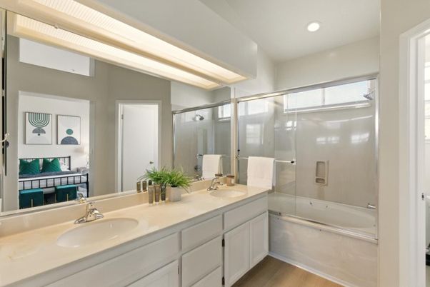 Bathroom, Dual Sink Vanities, Glass Shower, Interior, Recessed Lighting, Wood Texture Flooring