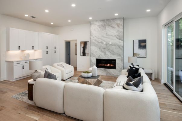 Fireplace, Interior, Living room, Marble Walls, Recessed Lighting, Wood Texture Flooring
