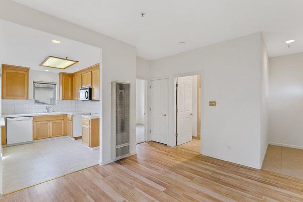 Interior, Kitchen, Recessed Lighting, Tile Countertops, Wood Texture Flooring