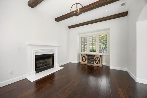 Empty room, Fireplace, Interior, Pendant Lights, Recessed Lighting, Wooden Beams, Wood Texture Flooring