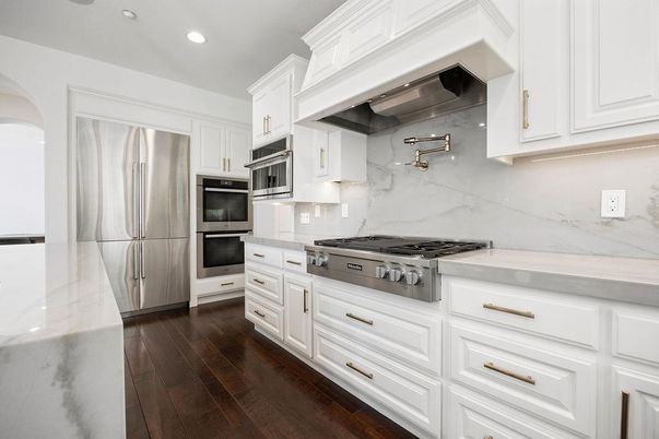 Interior, Kitchen, Marble Walls, Recessed Lighting, Stainless Steel Appliances, Wood Texture Flooring