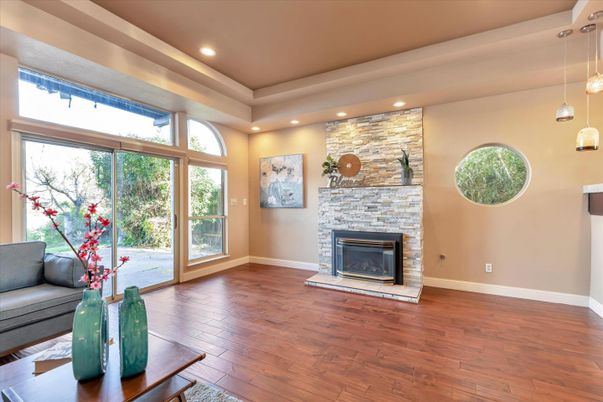 Fireplace, Interior, Pendant Lights, Recessed Lighting, Stone Walls, Wood Texture Flooring