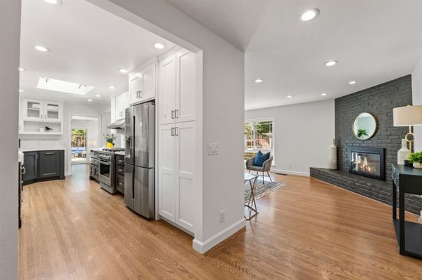 Fireplace, Interior, Kitchen, Recessed Lighting, Stainless Steel Appliances, Stone Walls, Wood Texture Flooring