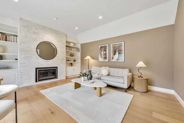 Fireplace, Interior, Living room, Recessed Lighting, Stone Walls, Wood Texture Flooring